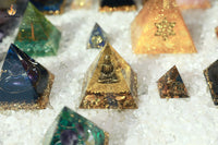 Golden Tiger Eye Crystal Pyramid with Seated Buddha PortraitExquisite Craftsmanship, Timeless Serenity